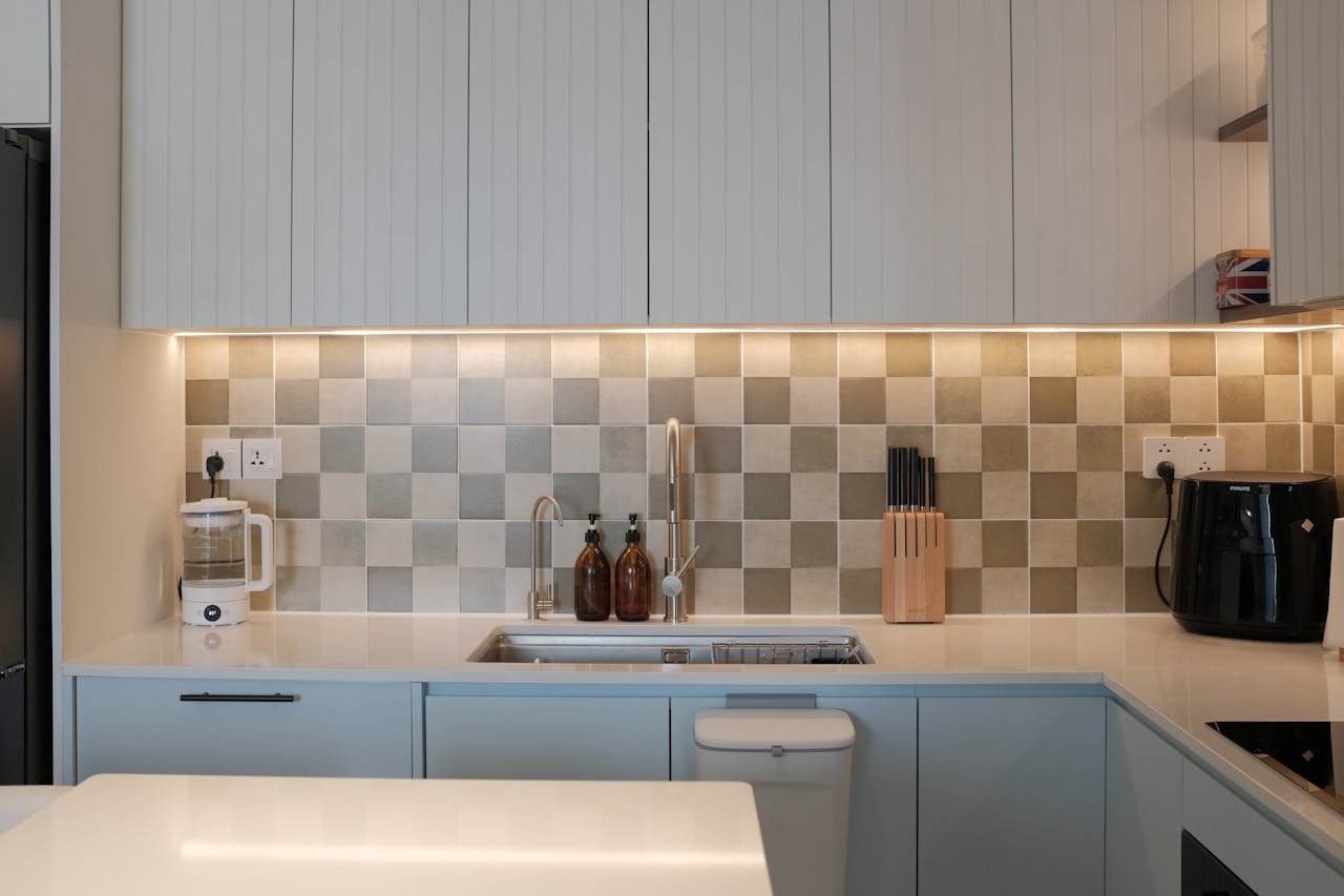 Contemporary minimalist kitchen with stylish decor and appliances.