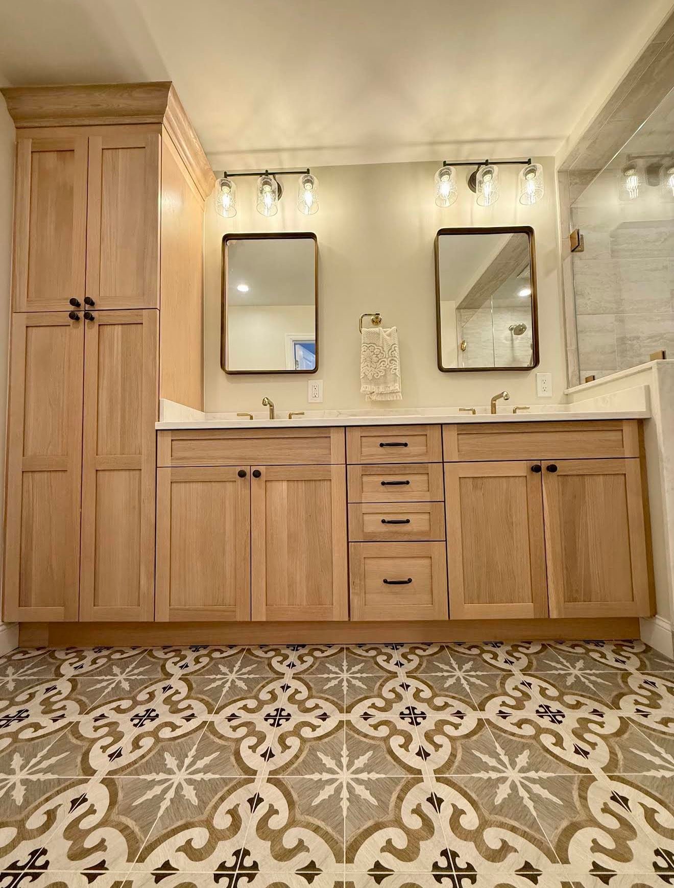 Patterned cement tile floor with wood vanity