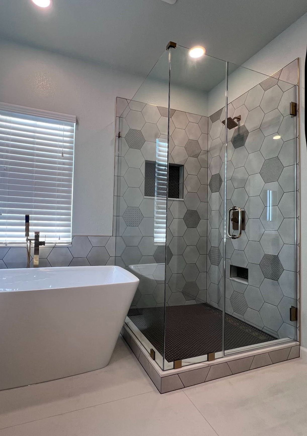 Hexagon tile shower with freestanding tub